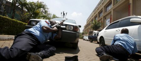 File photo of policemen taking cover near the main entrance of Westgate shopping mall during an attack by gunmen in Nairobi